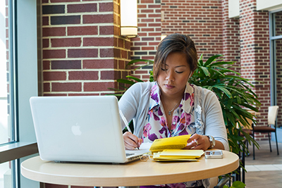 A woman working on a laptop